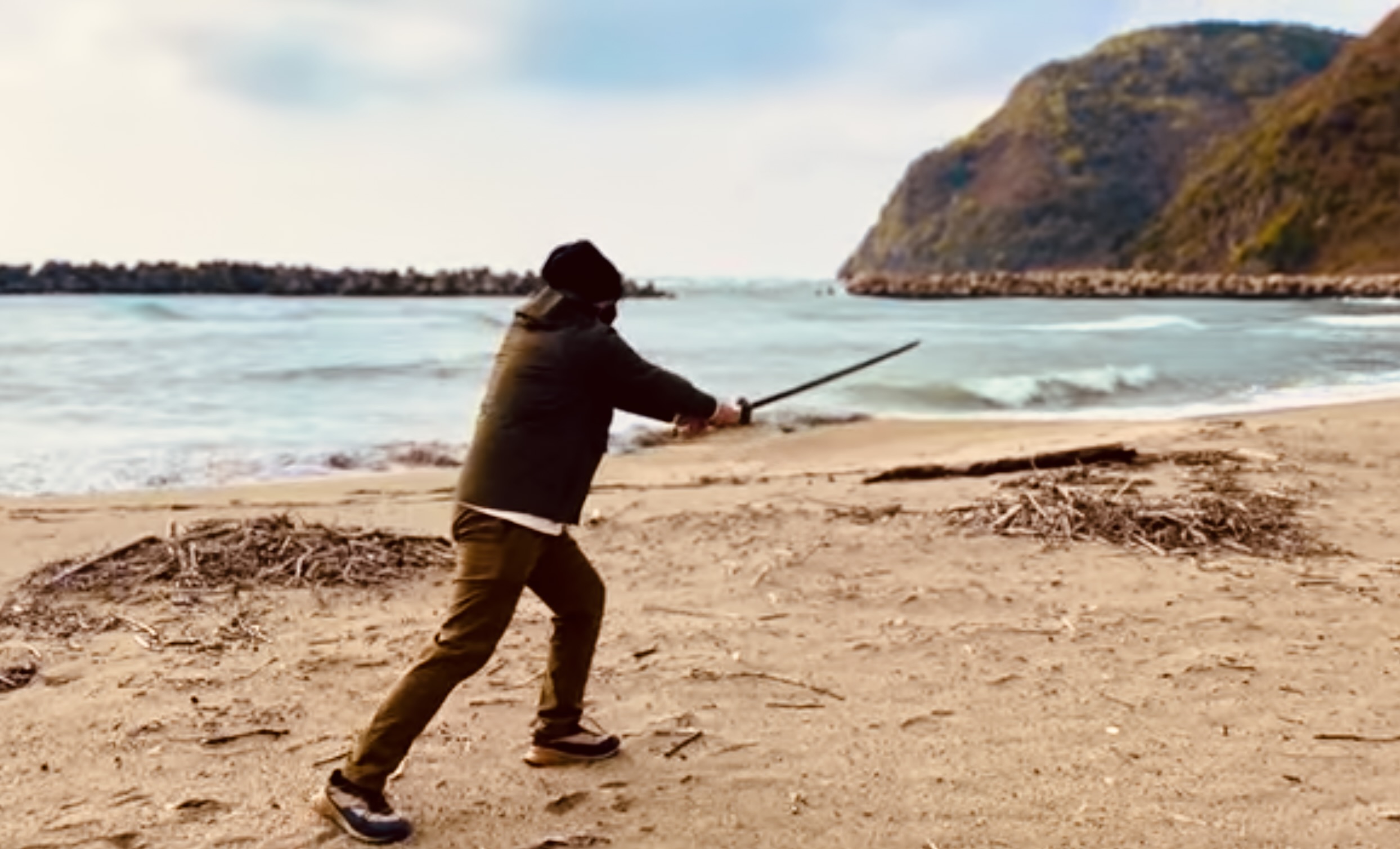 Practicing sword swings at Komoda Beach where the Mongol Invasion happened